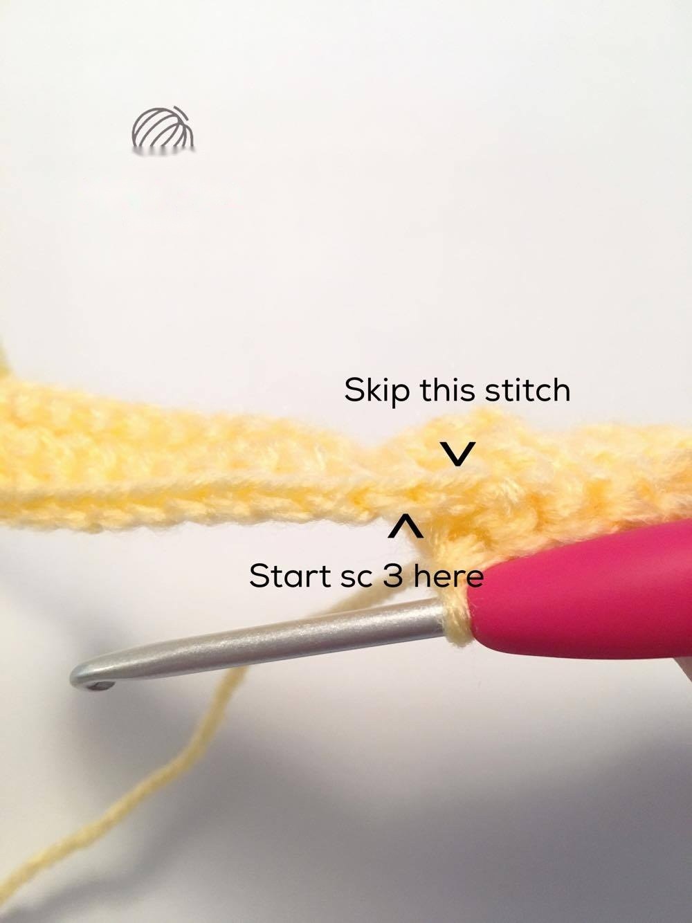 Single crocheting yellow fruit panels together and stuffing with polyfill
