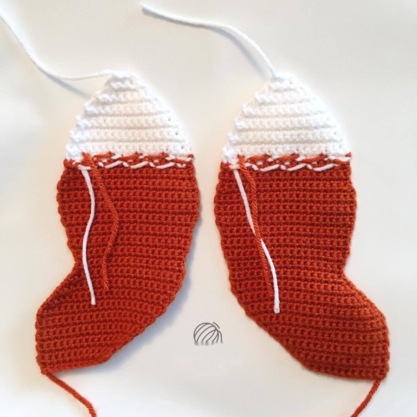 Embroidered sleeping eyelashes on white cheek patches with black nose