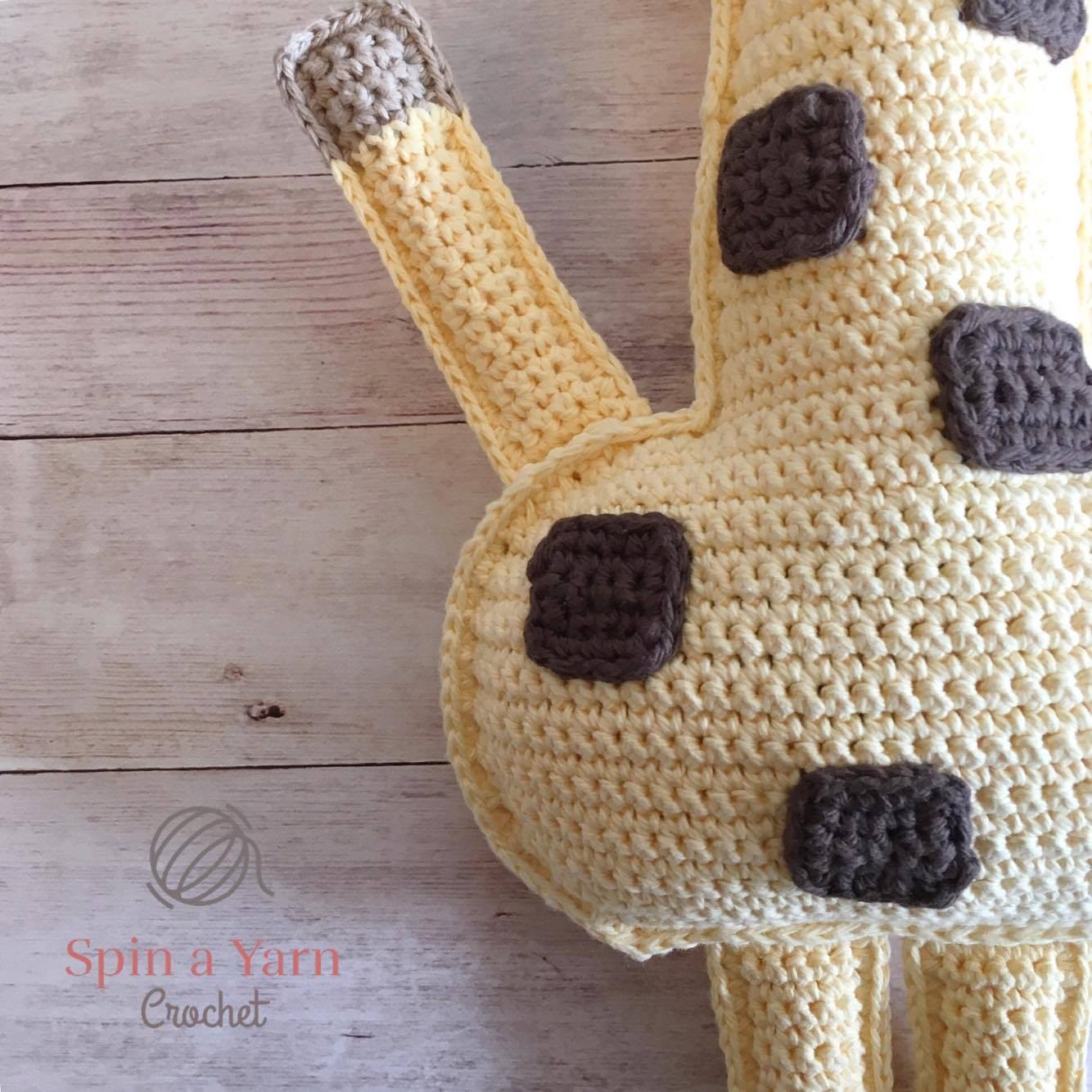 Single crocheting giraffe panels together and adding brown yarn mane