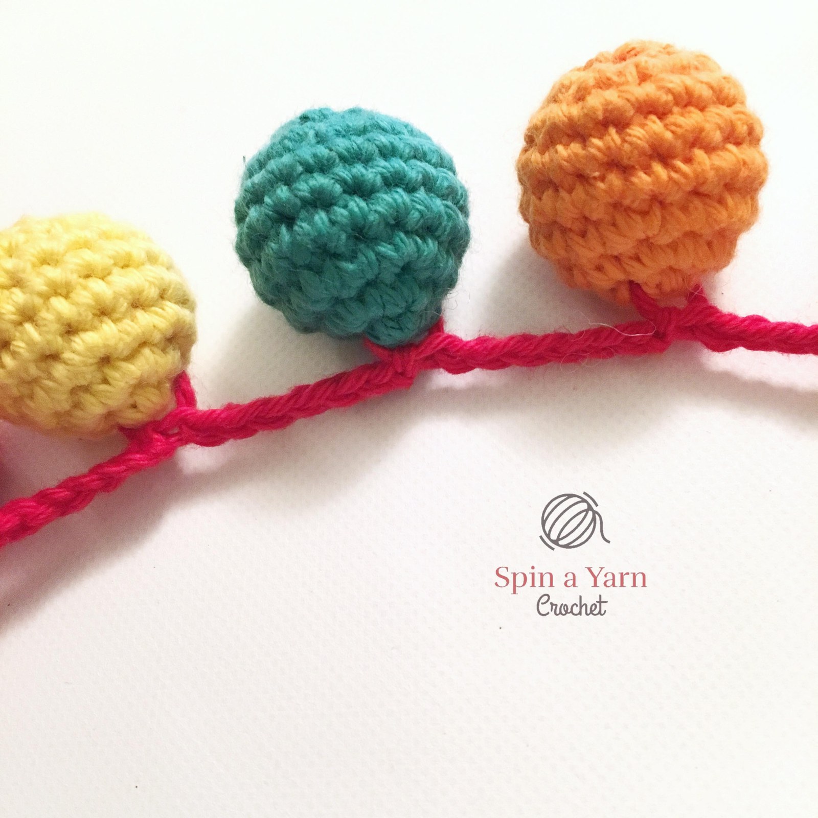 Crocheted cream llama legs joined across a continuous row