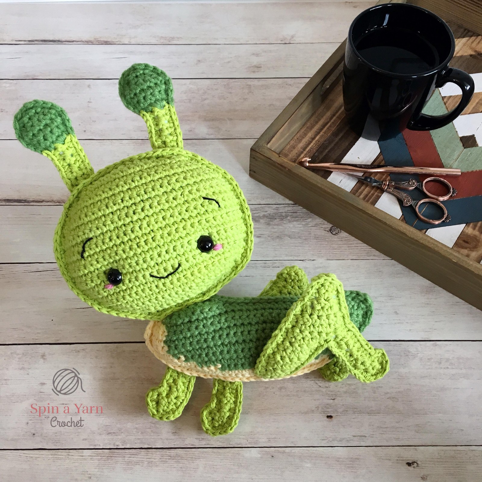 Completed crochet grasshopper