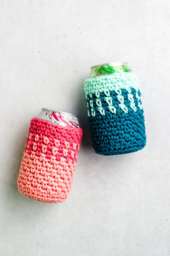 Striped cotton crochet can cozy holding a cold drink on patio table