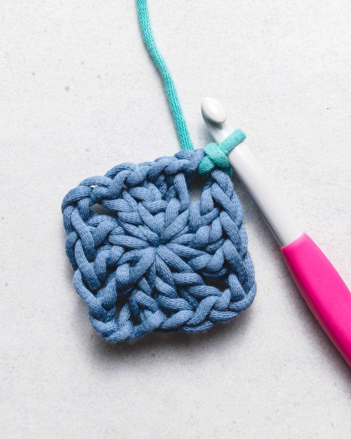 Two contrasting yarn colors transitioning seamlessly with sharp crisp line in crochet fabric