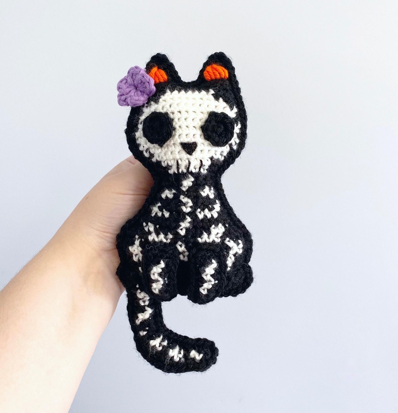 Finished crochet skeleton black cat with bone embroidery and floral eyes