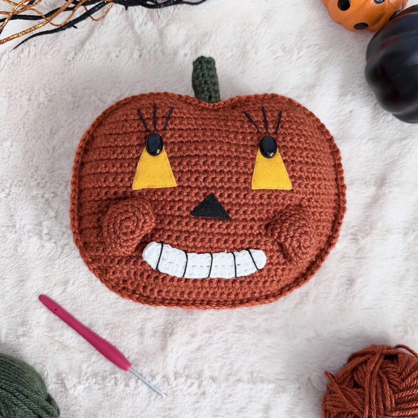 Vintage ribbed crochet pumpkin with sculpted lobes and embroidered smile